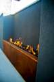 linear fire pit in stucco wall