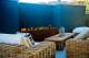 stucco wall and linear fire pit