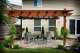 Backyard pergola and stone patio